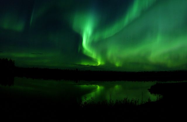 The Aurora Borealis or Northern Lights shine above Bear Lake in Alaska 050910 F MS415 009