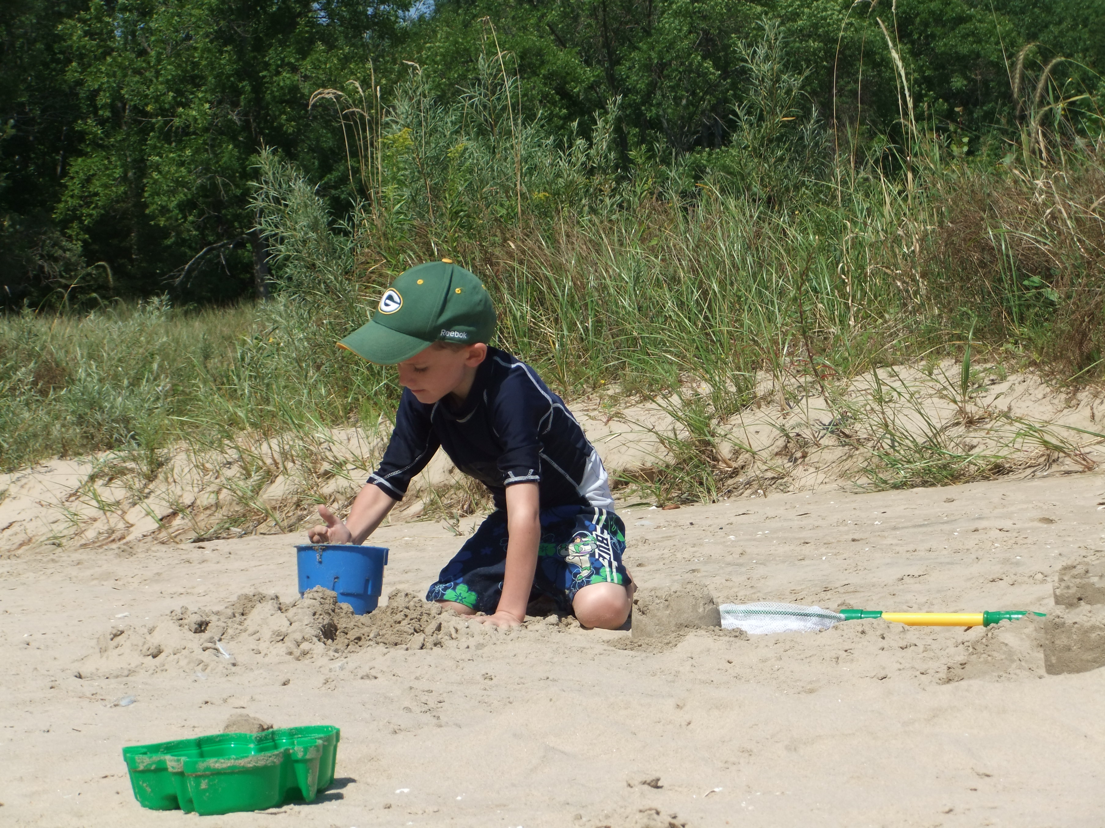 Playing in the sand at Harrington Beach State Park.