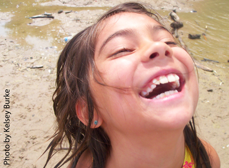 Laughing girl on the beach